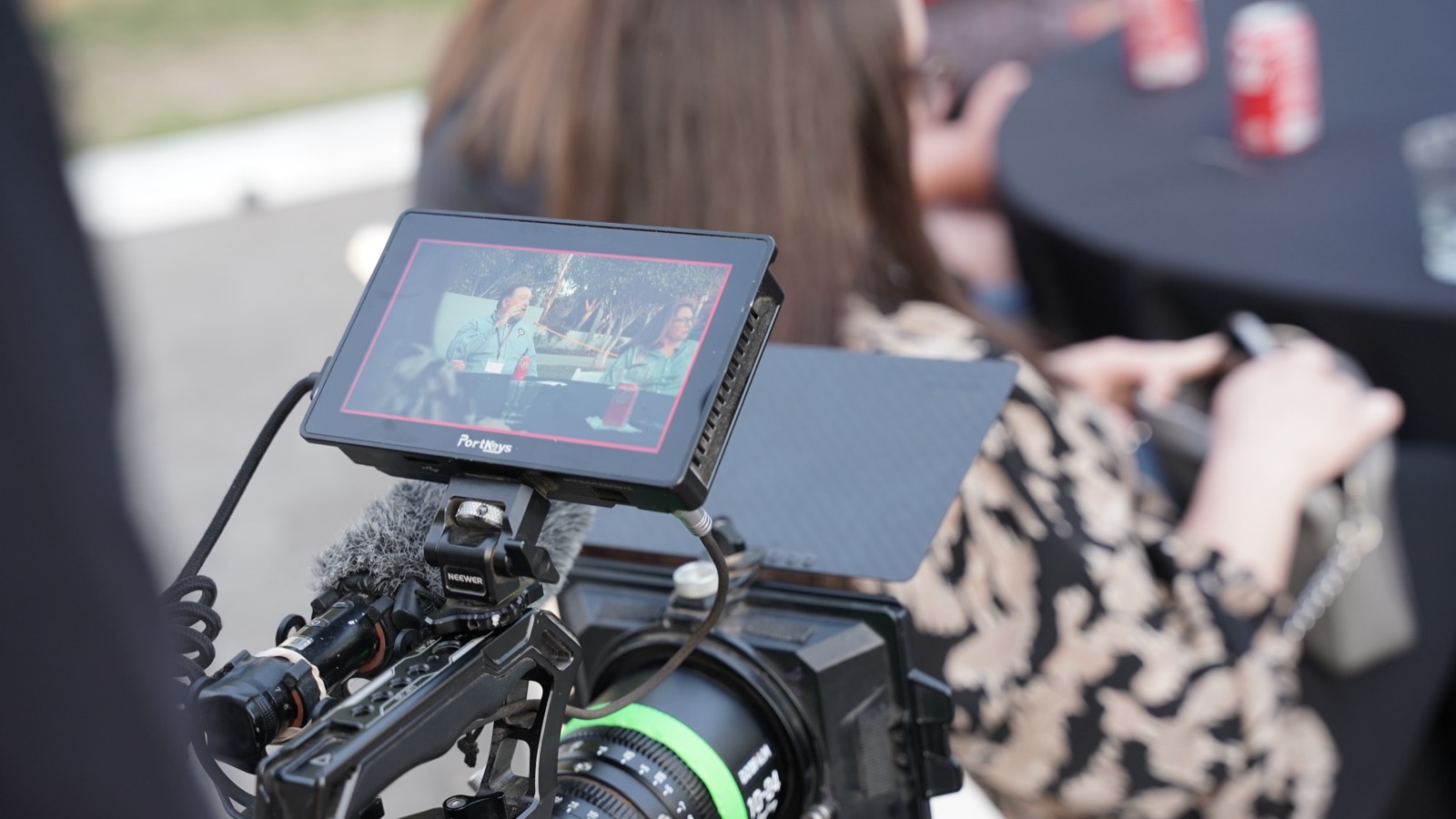 A cinema camera monitor on set showing the live frame